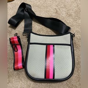 Neoprene crossbody bag with extra colorful strap
